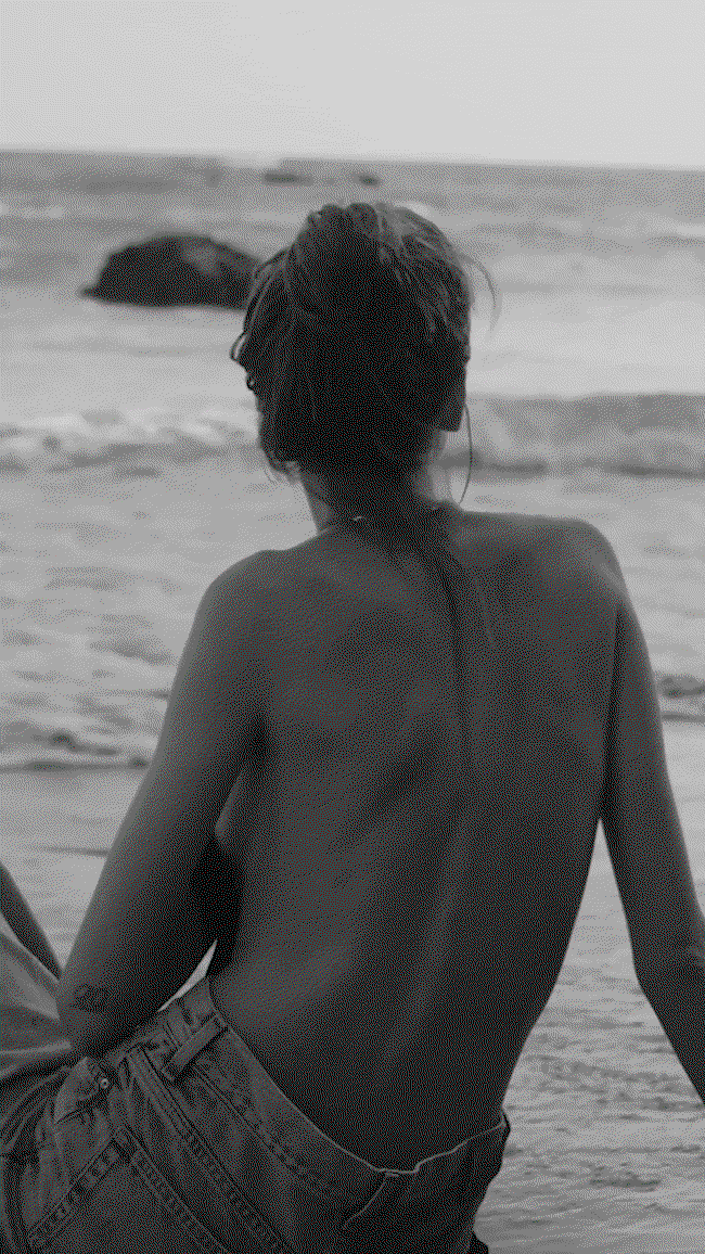 GIF of model at the beach wearing the Golden Tone collection.