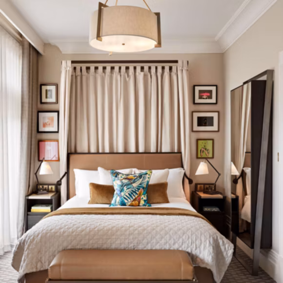 The elegant Queen Premium Park View room at Kimpton Fitzroy, linking to BA High Life site.