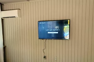 How to keep your big TV from becoming the focal point of your living room (cool idea!)