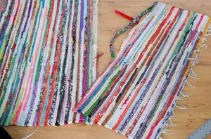 Cut up a dollar store rug and a $5 plastic bucket for this brilliant storage hack