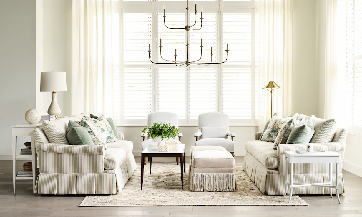 Living room with pleated sofa and 2 arm chairs.