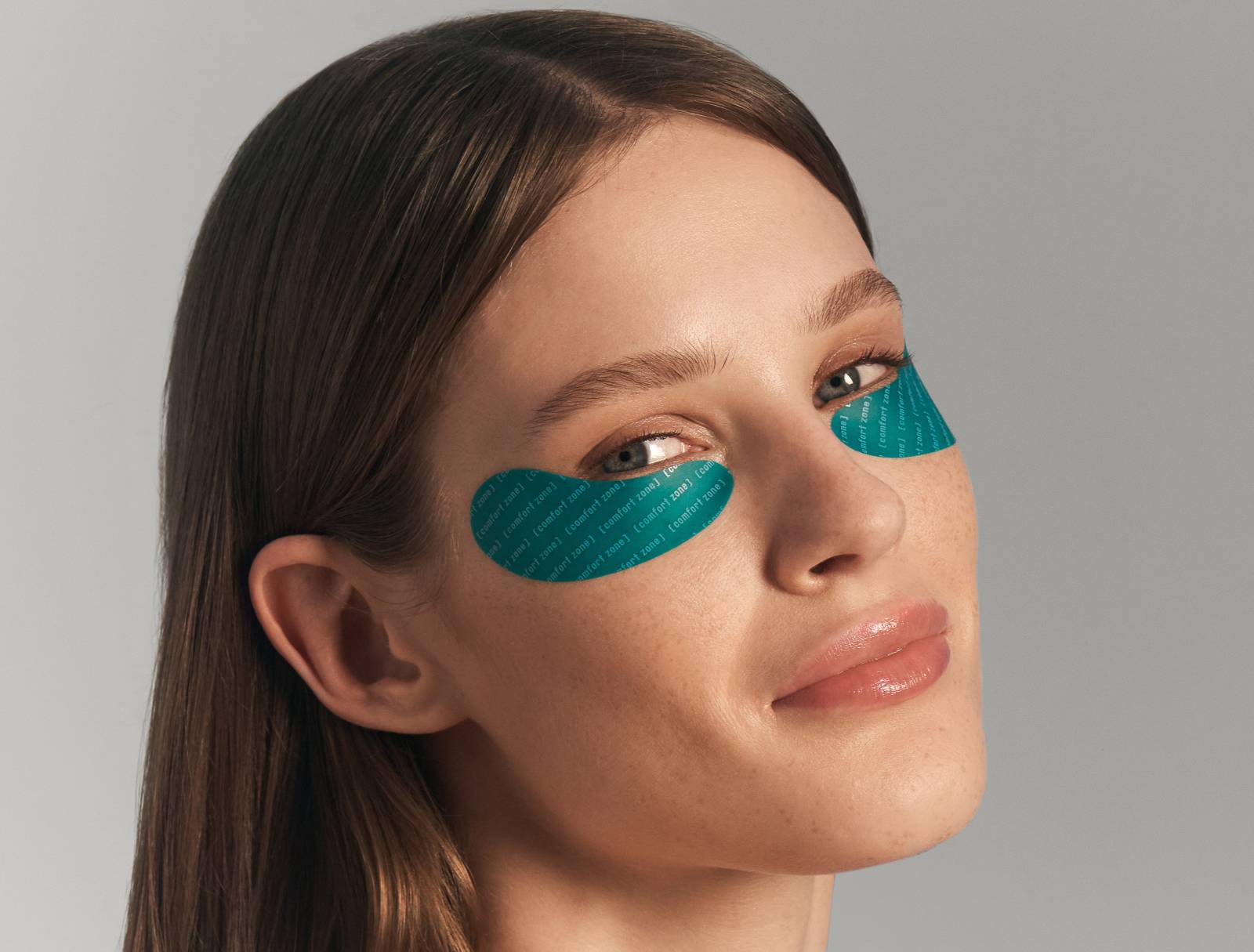 Woman wearing blue silicone eye patches