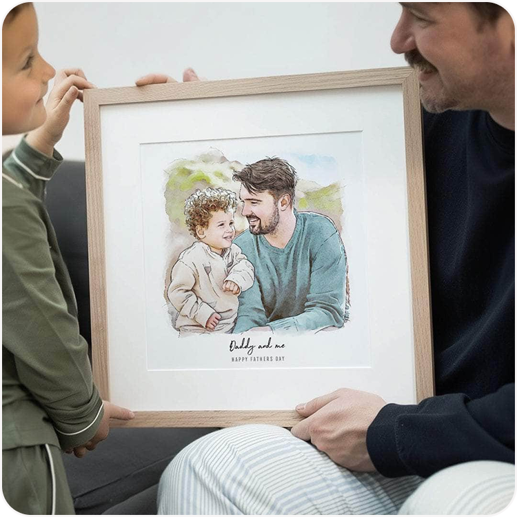 A father and young child looking together at a framed watercolour illustration of themselves, personalised with "Daddy and me"