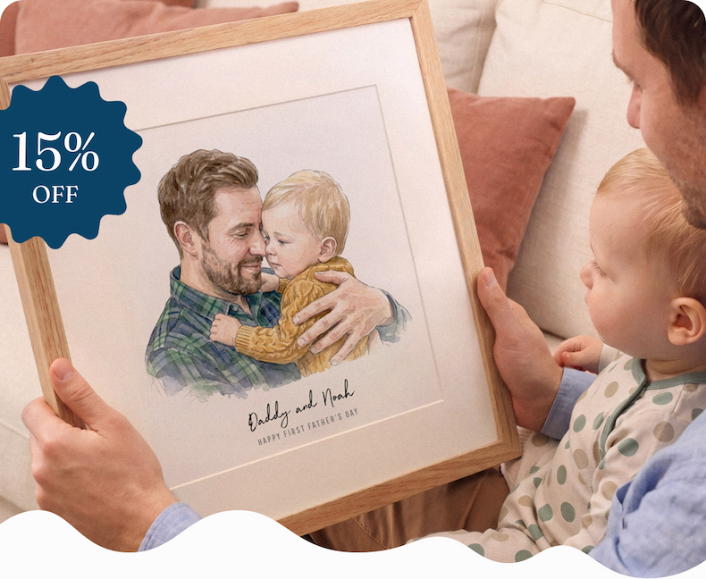 A father holds a framed watercolour portrait of himself with his young son, personalised with "Daddy and Noah, Happy First Father's Day"