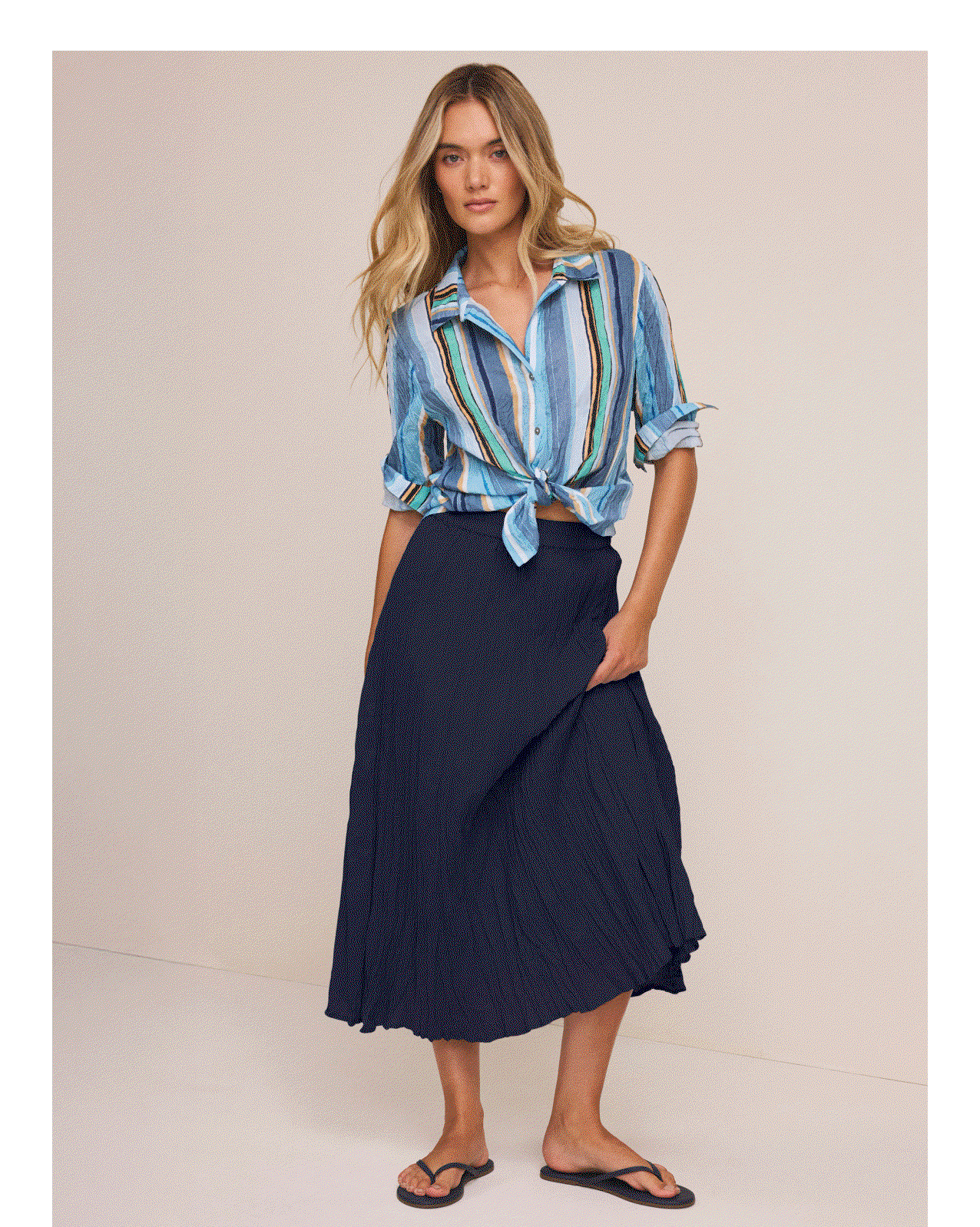 Multiple women wearing assorted outfits with crinkle skirts