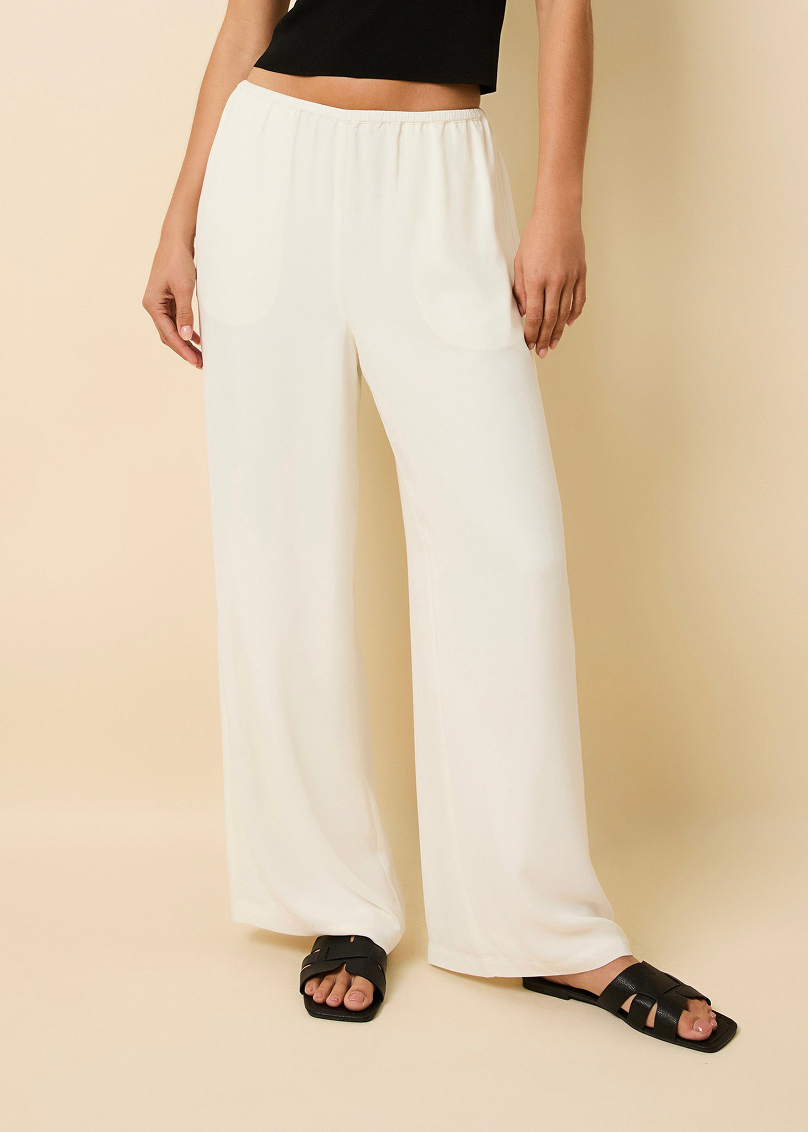 Woman wearing white pants