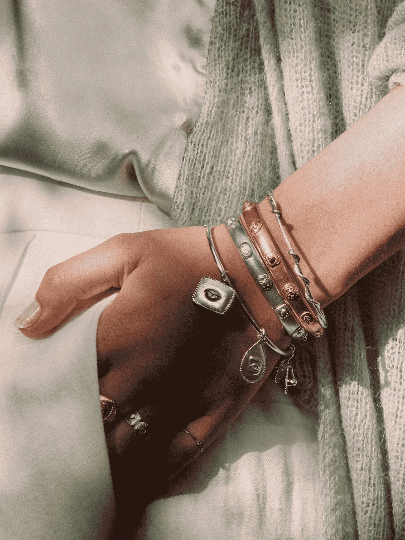 A model wearing a stack of Sense of Nature Bangles and Bracelets