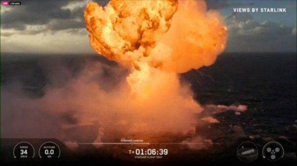 A huge explosion sees orange flame plume above the sea which has debris and smoke.