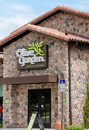 Exterior of an Olive Garden Italian Kitchen restaurant.