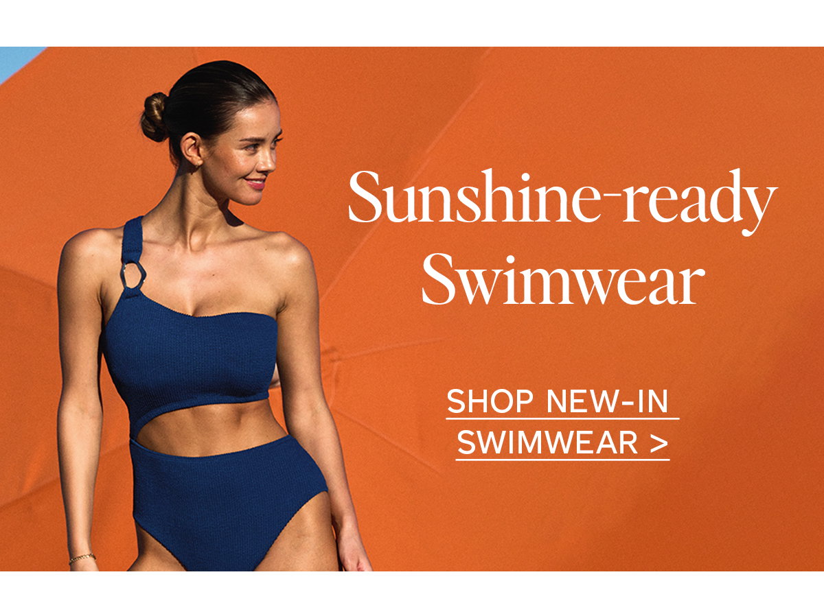 Sunshine-ready Swimwear. Model wears Talamanca swimsuit in petrol blue. Click to shop new-in swimwear.