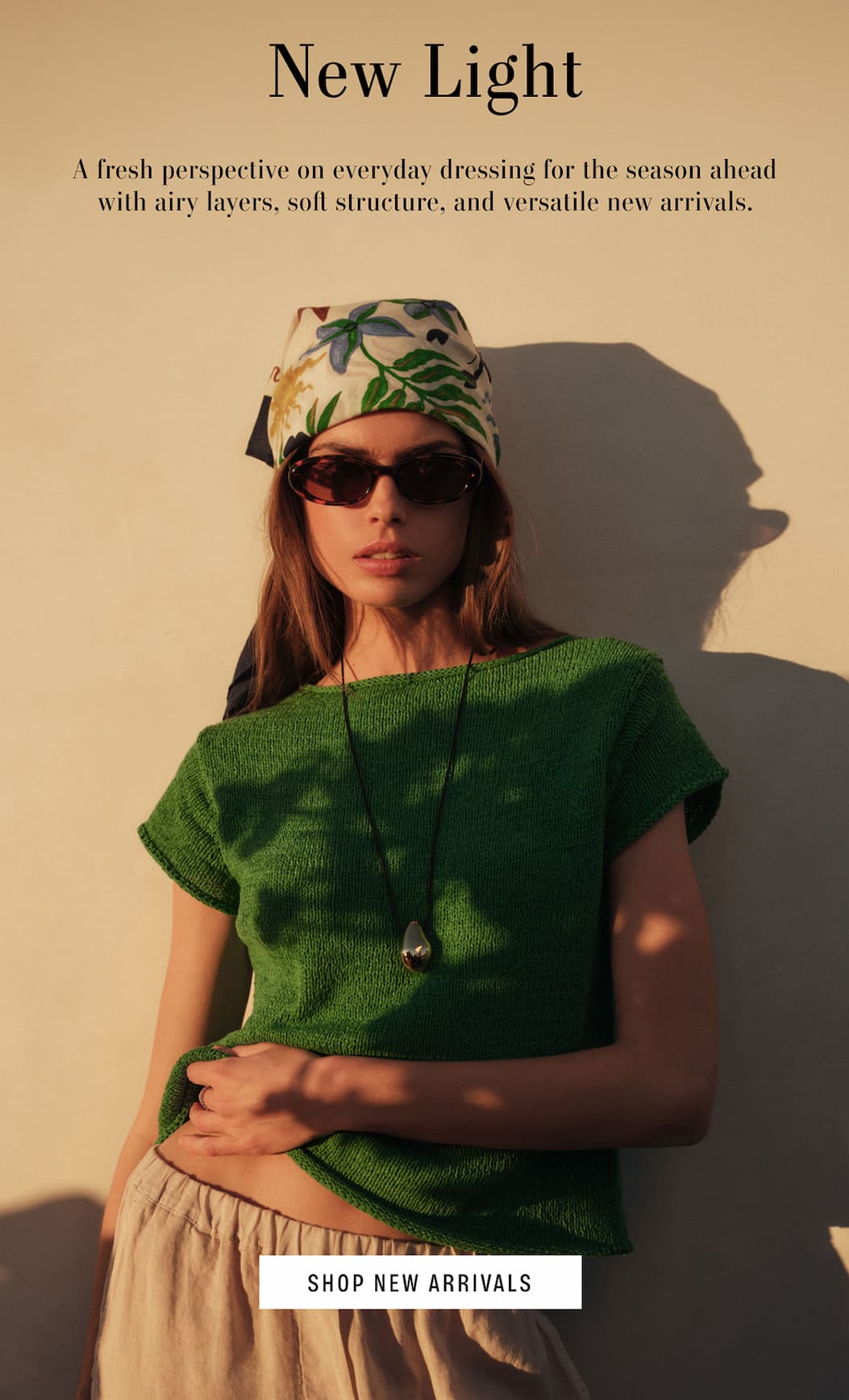 New Light. A fresh perspective on everyday dressing for the season ahead with airy layers, soft structure, and versatile new arrivals. Model wearing Milou Sweater and Soli Scarf on her hair. Shop New Arrivals