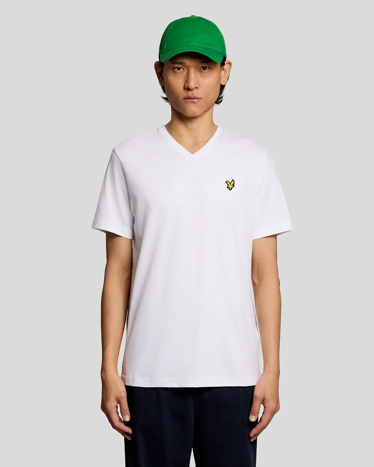 Model wearing a v-neck t-shirt in white