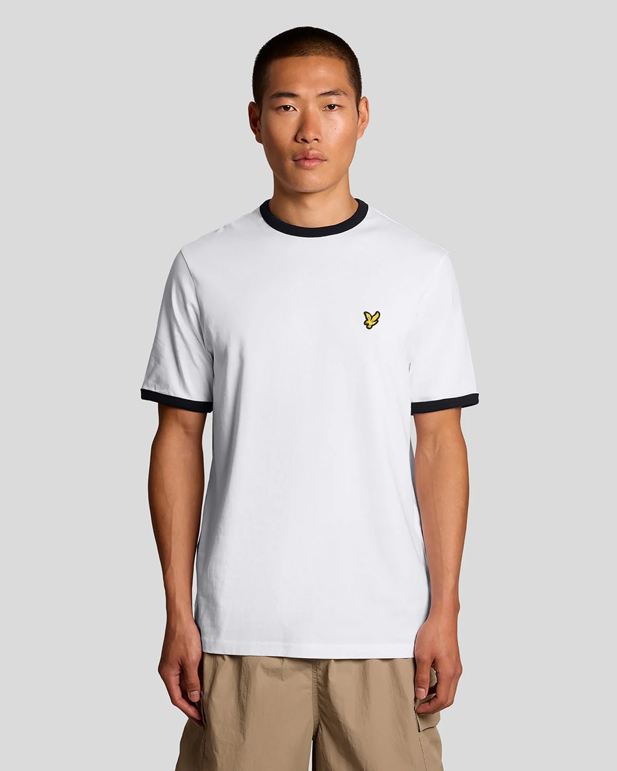 Model wear ringer crew neck t-shirt in white/jet black