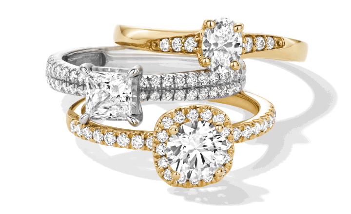 Diamond engagement rings in yellow gold and white gold with round and princess-cut center stones.