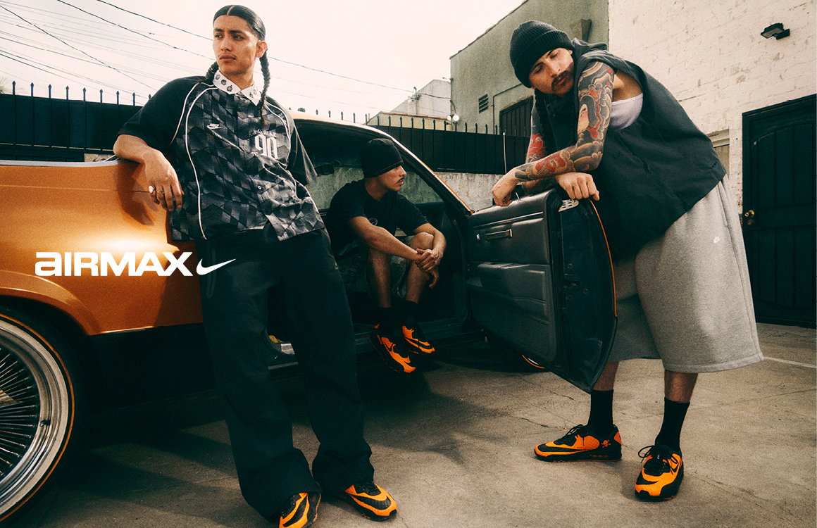 men sitting inside and standing in front of a car with nike clothings and airmax shoes