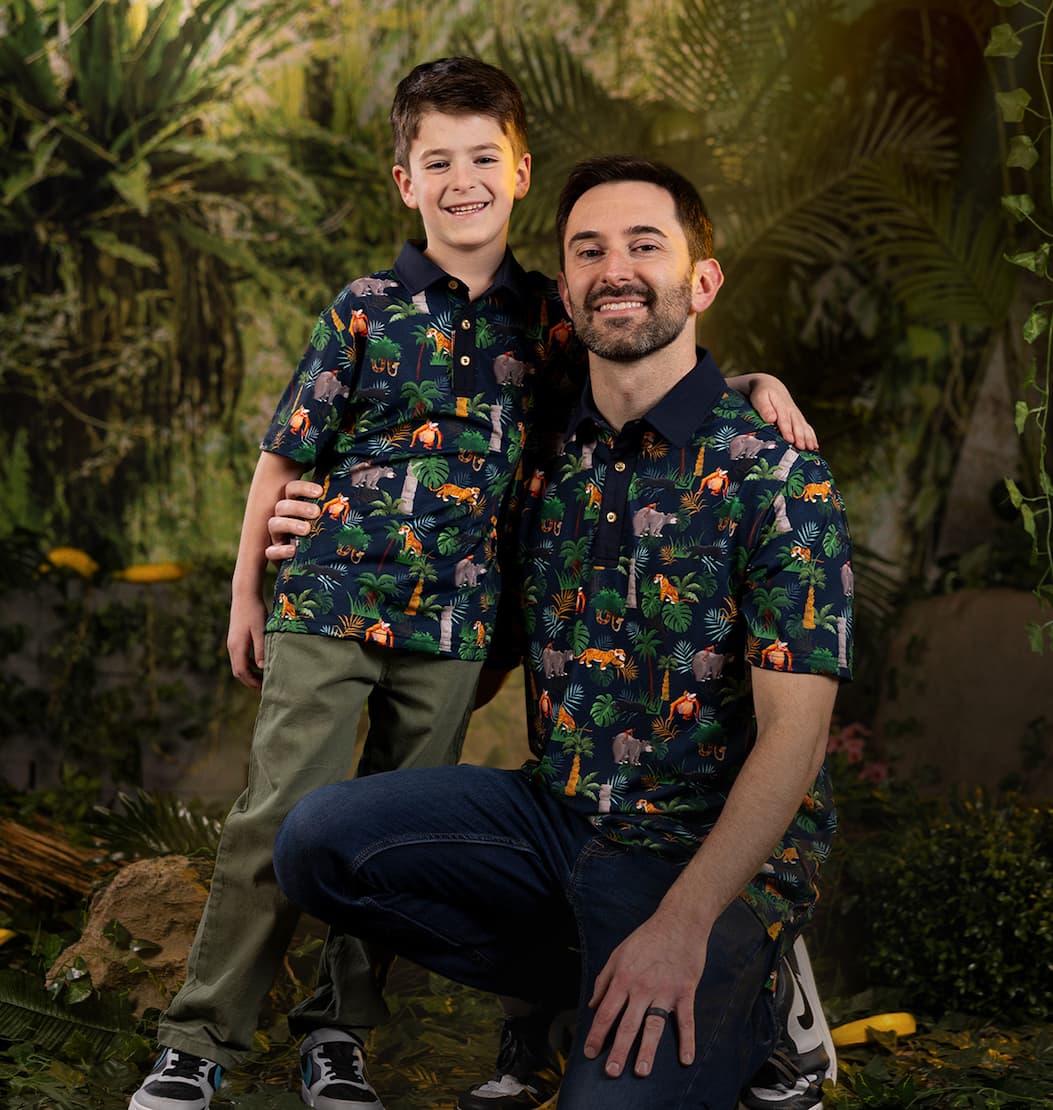 Man and child wearing matching all-day polos