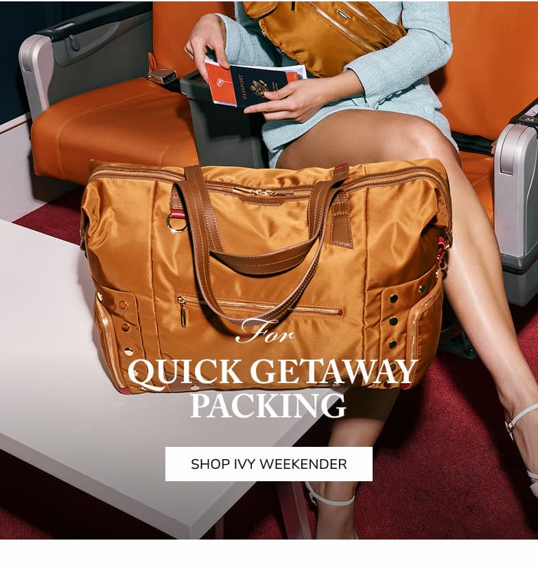 For quick getway packing. Shop Ivy Weekender. Model on airplane with ivy weekender in amber gold. 
