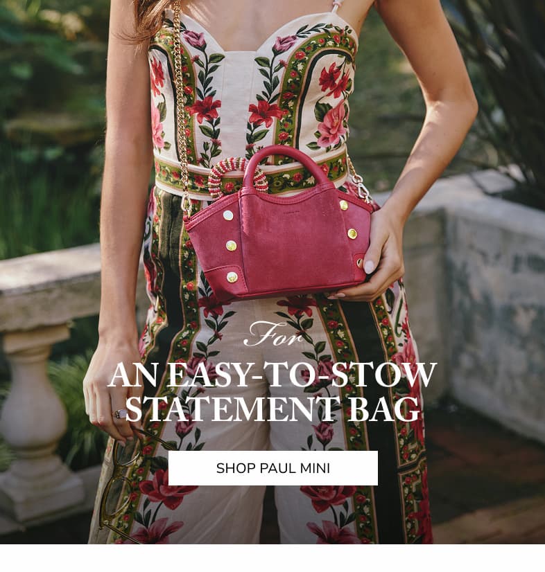 For an easy to stow statement bag. Shop paul mini. Model with paul mini in calypso suede. 