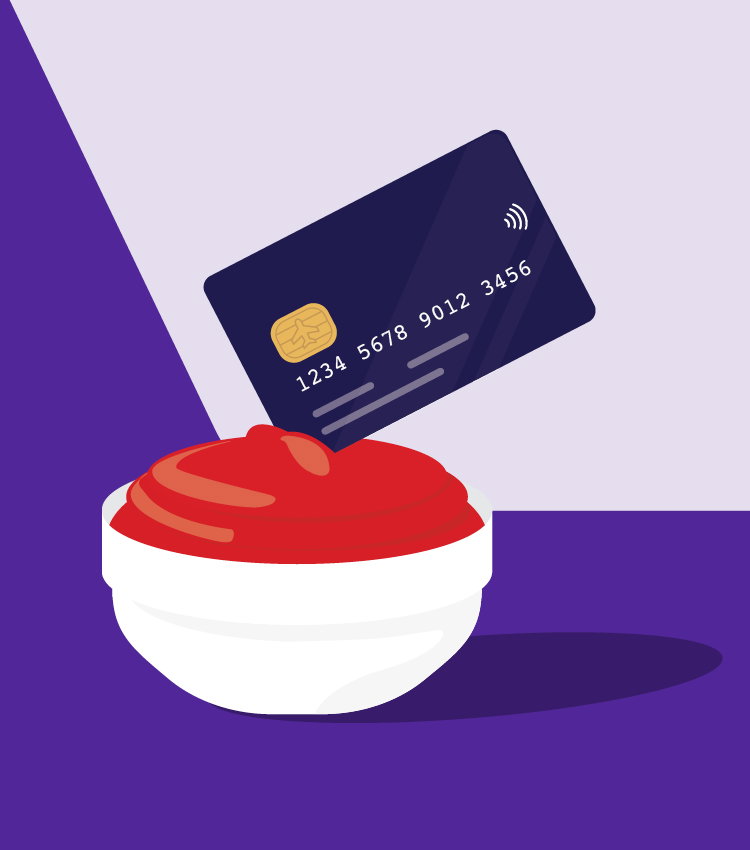 Credit card being dipped in a red sauce