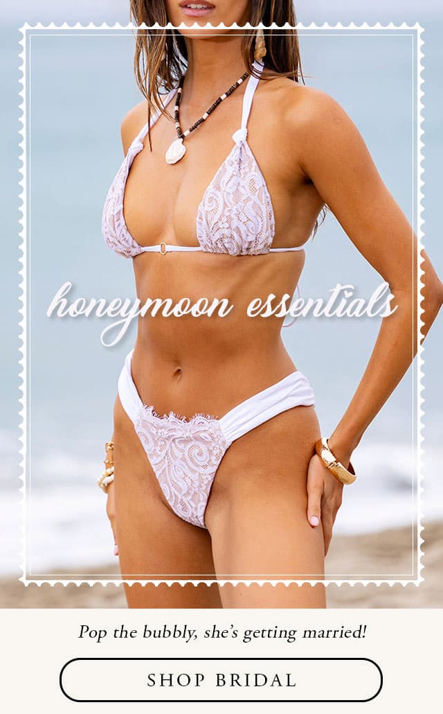 Model wearing white lace bikini. shop bridal. 