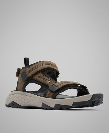 A brown and grey sneaker against a grey background.