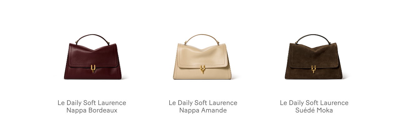 an image of a woman in a white cape and a black purse