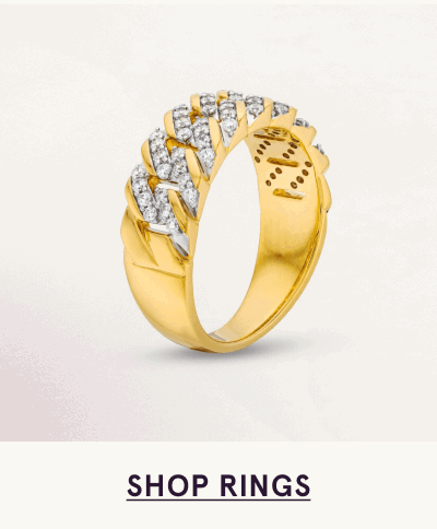 A gold curb-link ring featuring pavé-set diamonds on  the top. Click here to shop rings