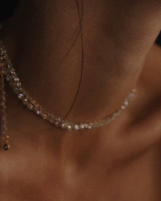 GIF of model wearing Floating Eternity Necklaces in 3.5MM and 5MM Honey Moissanite. 