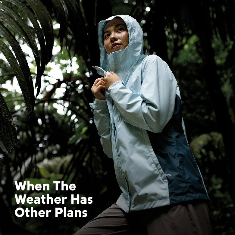 When the weather has other plans. Woman hiking in light rain. 