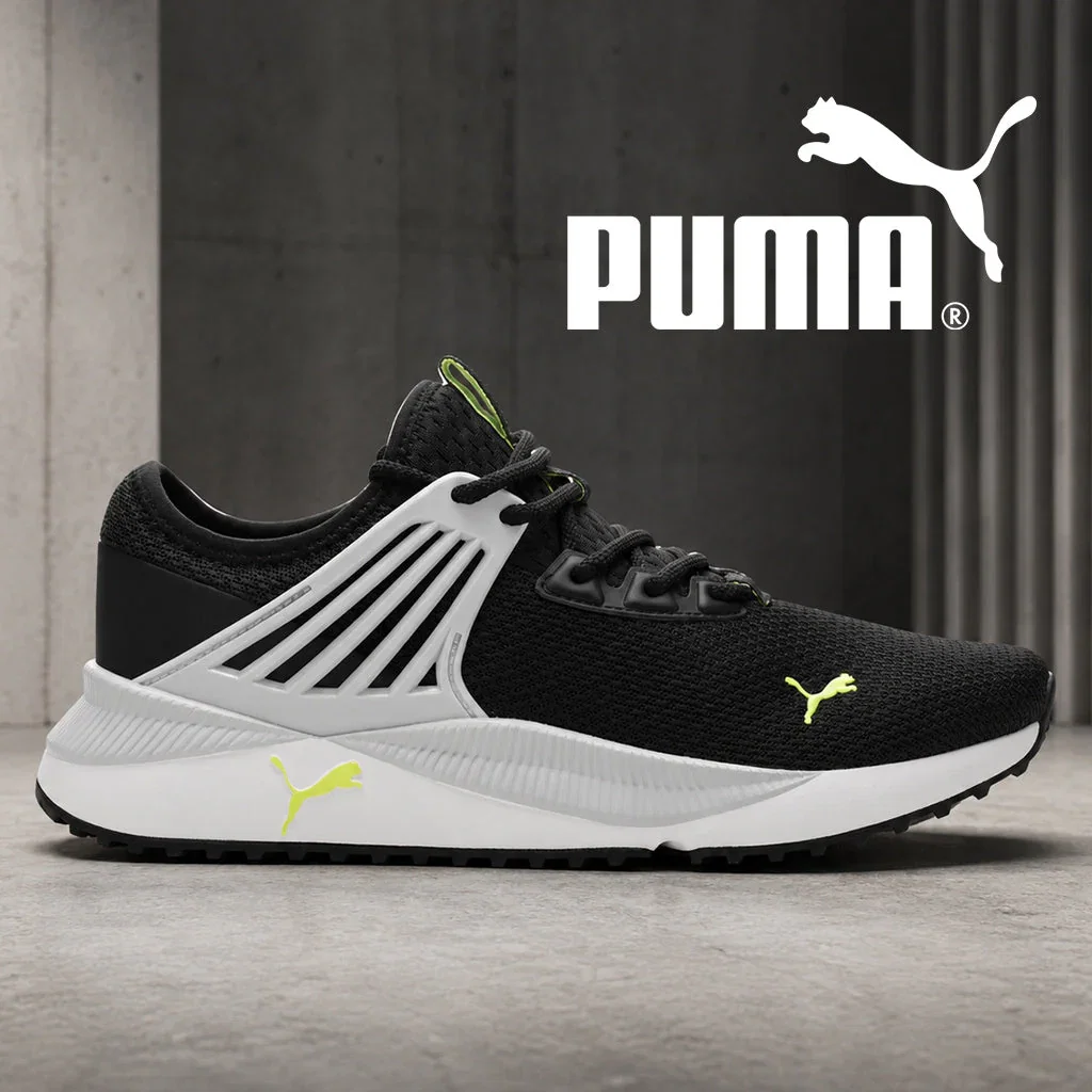 PUMA black and white running shoe with neon yellow accents and logo detail displayed against gray backdrop.