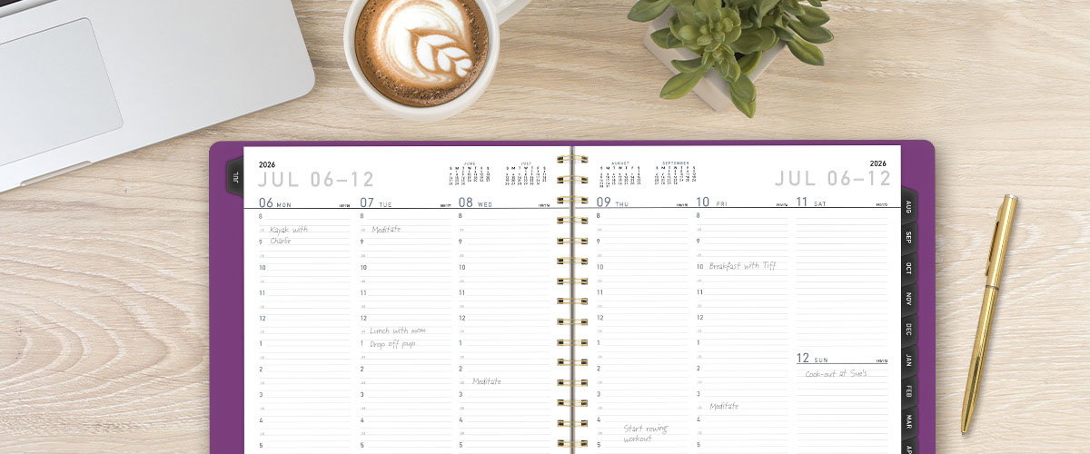 An open purple planner with appointments written in it