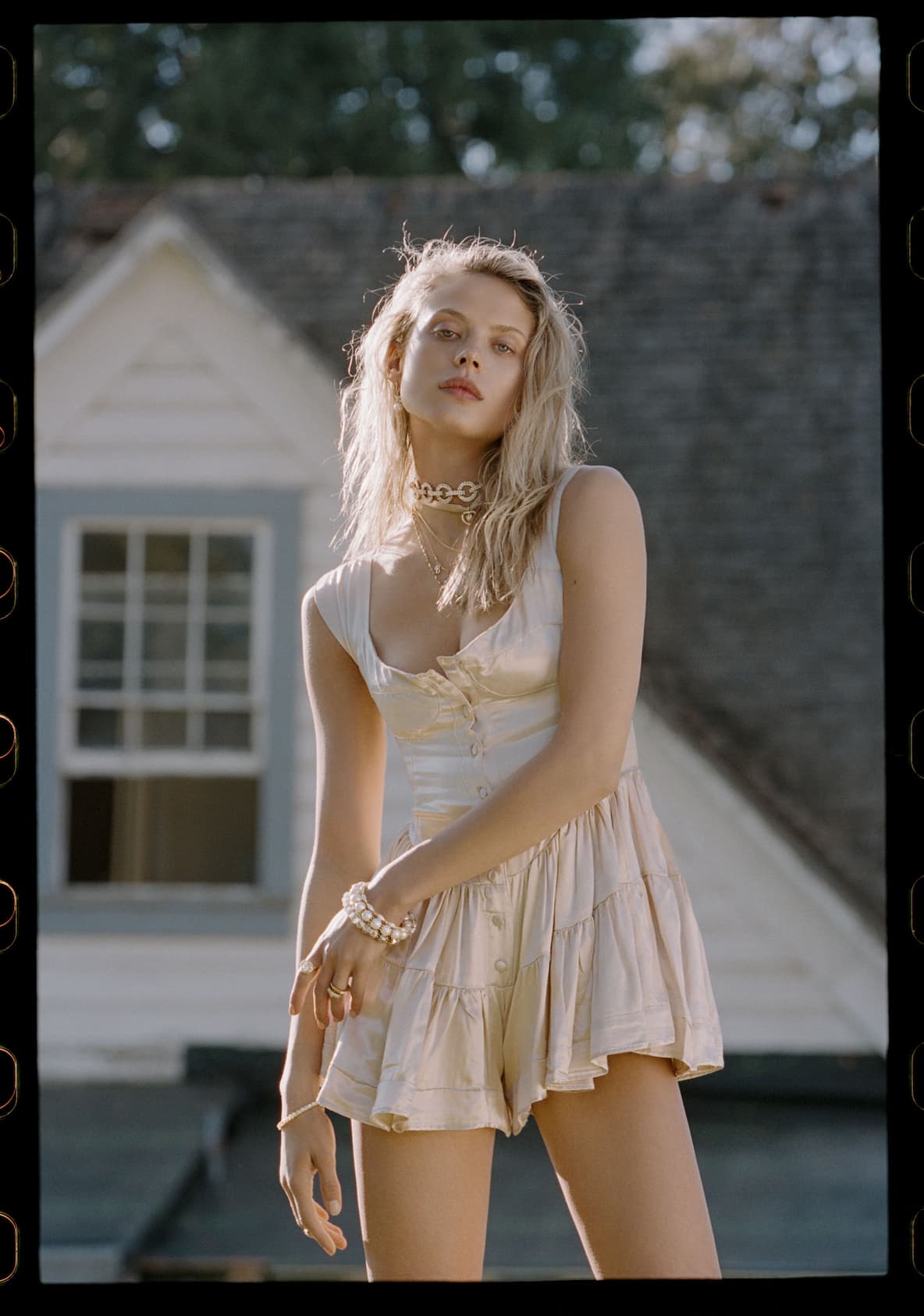 an image of a woman in a dress is posing for a picture