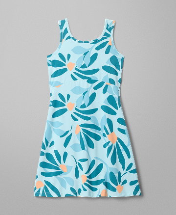 Flatlay of a girls' blue floral sun dress against a grey background.