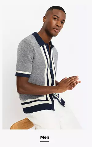 A man in a black and white shirt. Shop men.