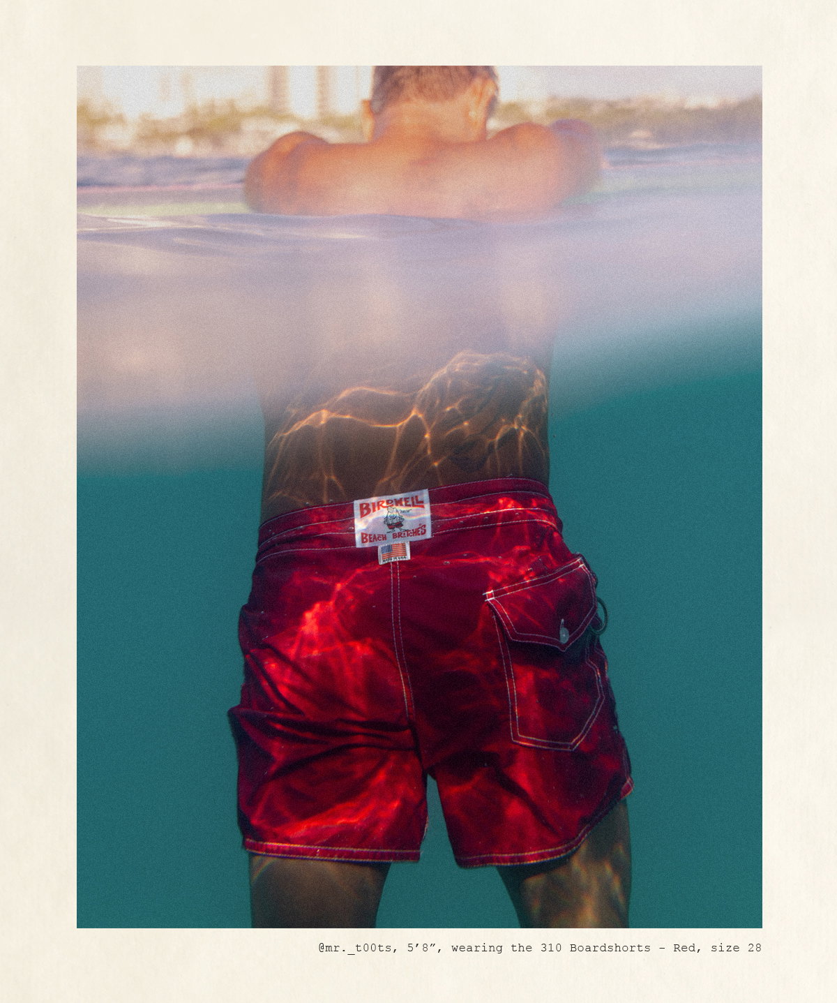Toots, 5'8", wearing the 310 Boardshorts - Red, size 28