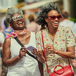 adult african american women laughing together