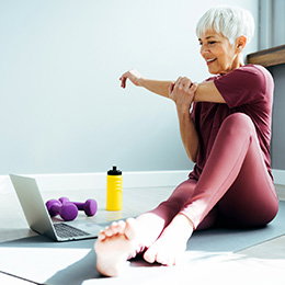 Senior adult woman doing exercises at home