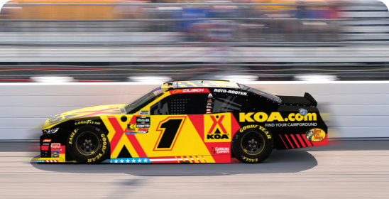 A nascar stock car with KOA branding. 