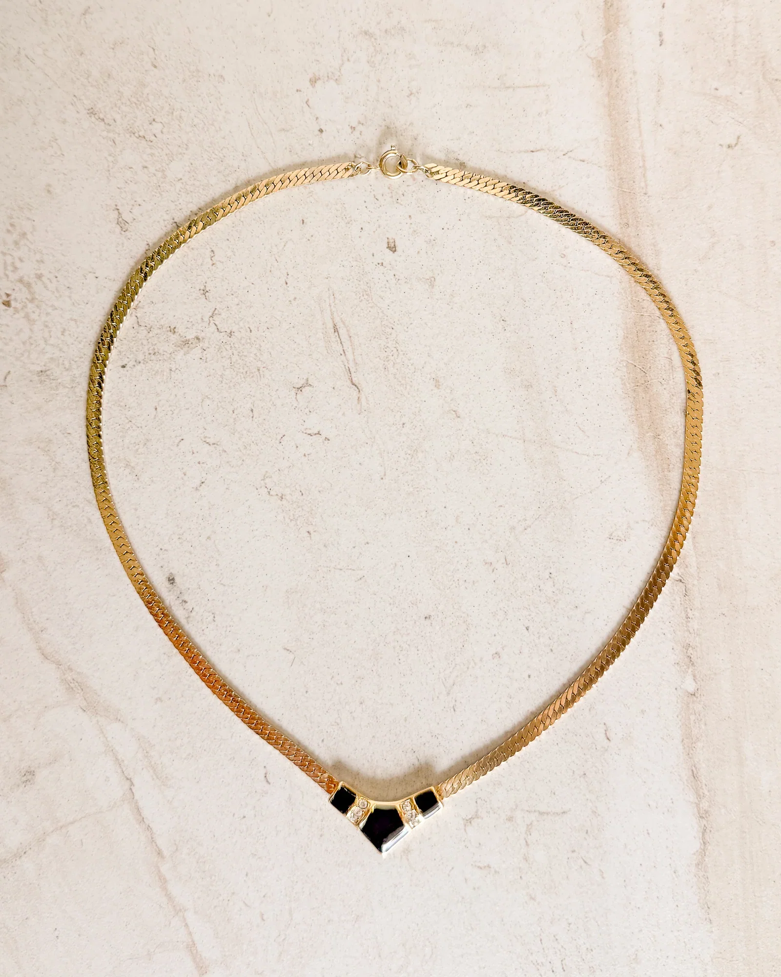 Image of Vintage black enamel pendant gold-tone rhinestone V necklace