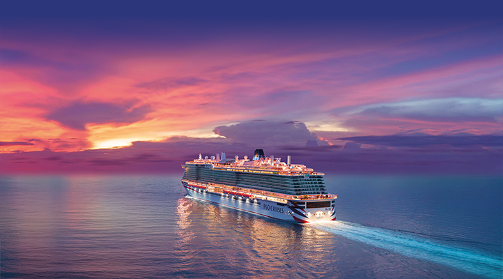 P&O Cruises ship sailing into a vibrant sunset