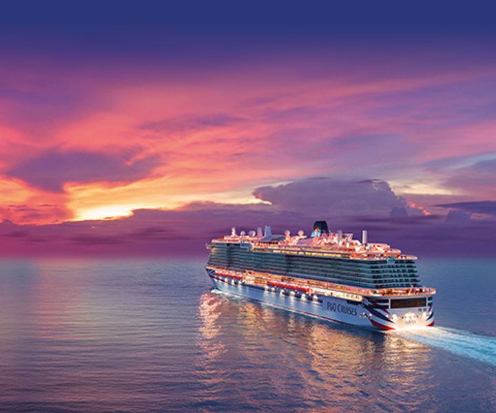 P&O Cruises ship sailing into a vibrant sunset