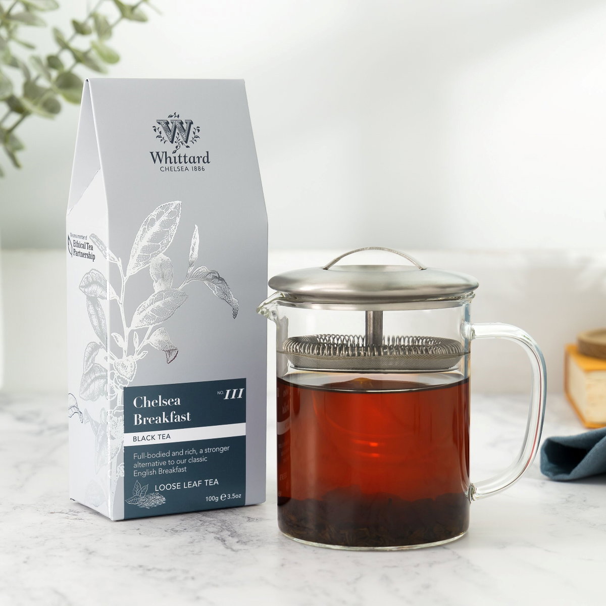 image of chelsea breakfast loose tea pouch with made up tea in infuser