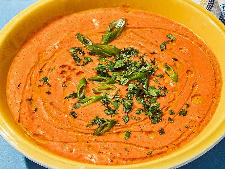 Tomato gazpacho topped with olive oil, fresh mint, cilantro and chopped green onions.
