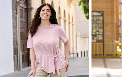 Ein Model trägt ein roséfarbenes Shirt mit Bindebändern und eine champagner-goldfarben Leinenhose mit Lurexfaden