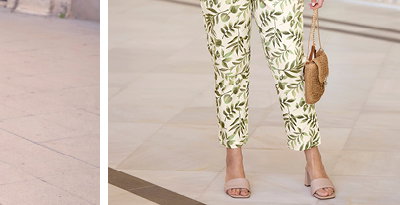 Ein Model trägt eine champagner farbene Tunika mit Schleifendetails an den Ballonärmeln und eine champagner-pistazie-gemustert Druckhose in schmaler Form