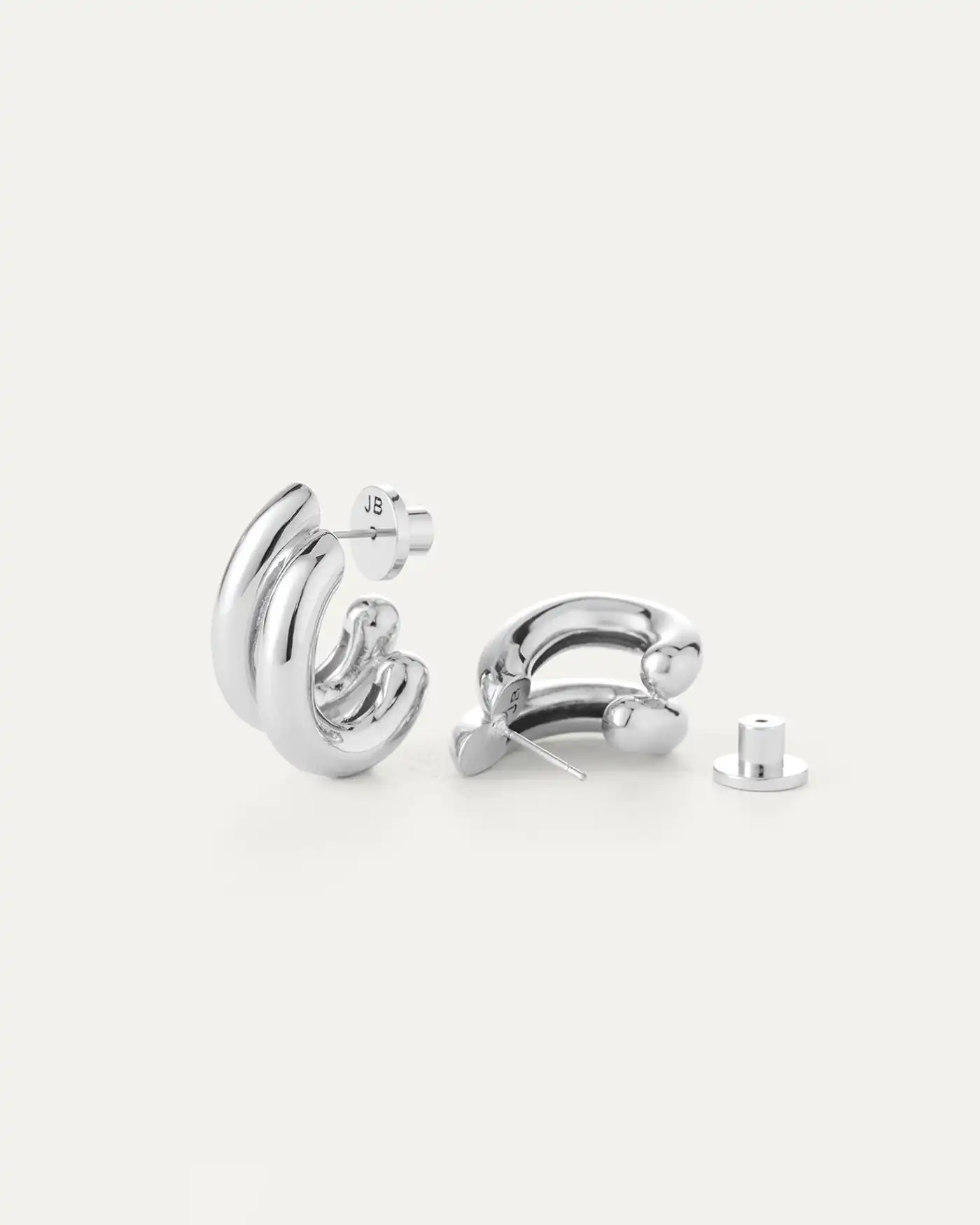 Discover our most talked-about earrings. Dramatic and voluminous, this custom design creates the illusion of two chunky hoops stacked together, with a...
