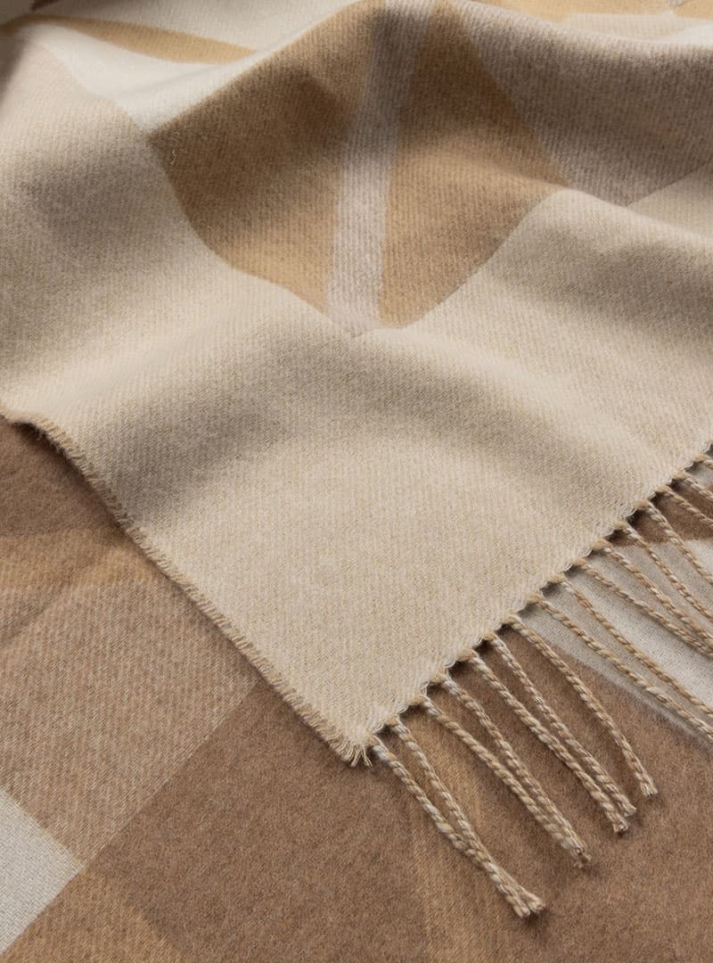close up of light natural geometric throw