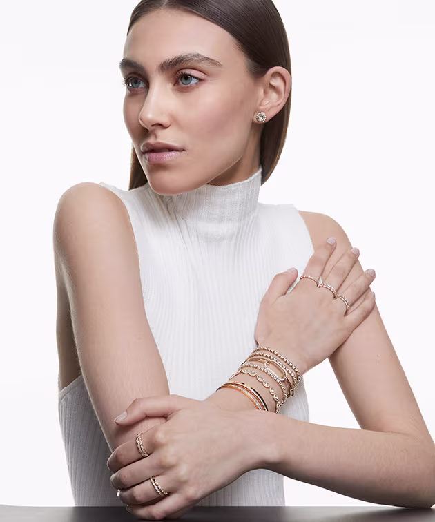 Model wearing gold-toned Una Angelic jewelry