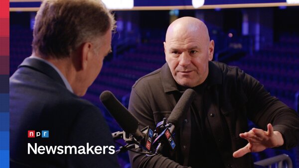 UFC CEO Dana White sitting at a mic as he speaks to NPR’s Steve Inskeep for a NPR Newsmakers interview. 