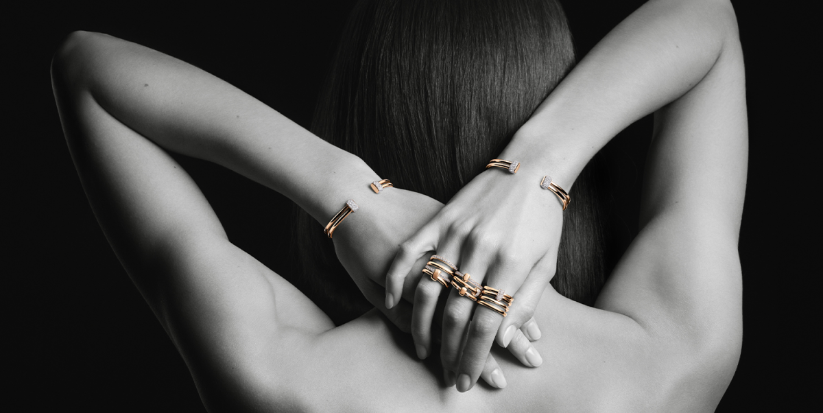 Woman wearing Pomellato rings and bracelets